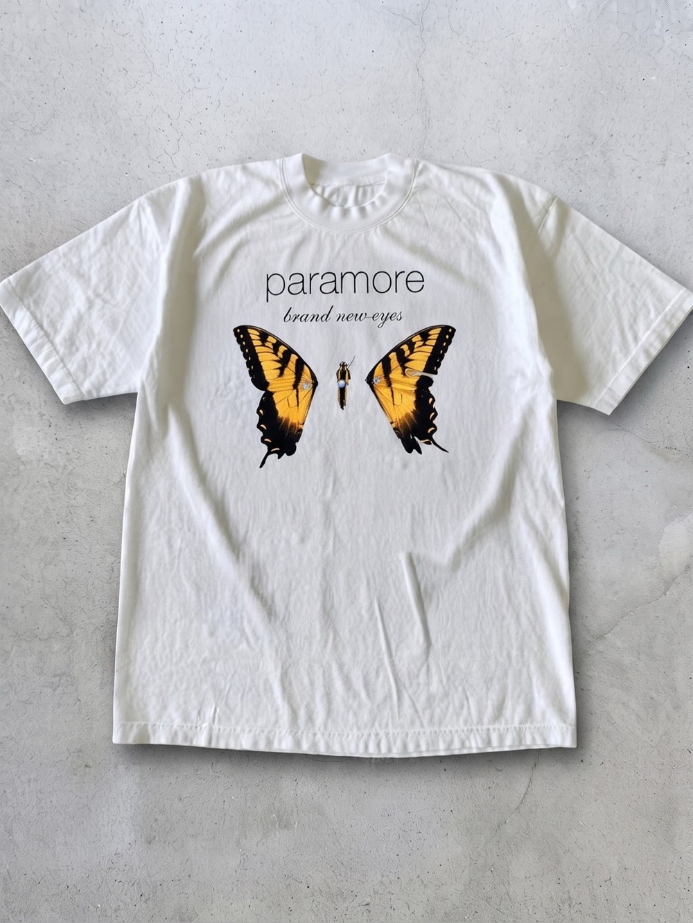 White Paramore Brand New Eyes Graphic
Tee With Yellow Butterfly Graphic